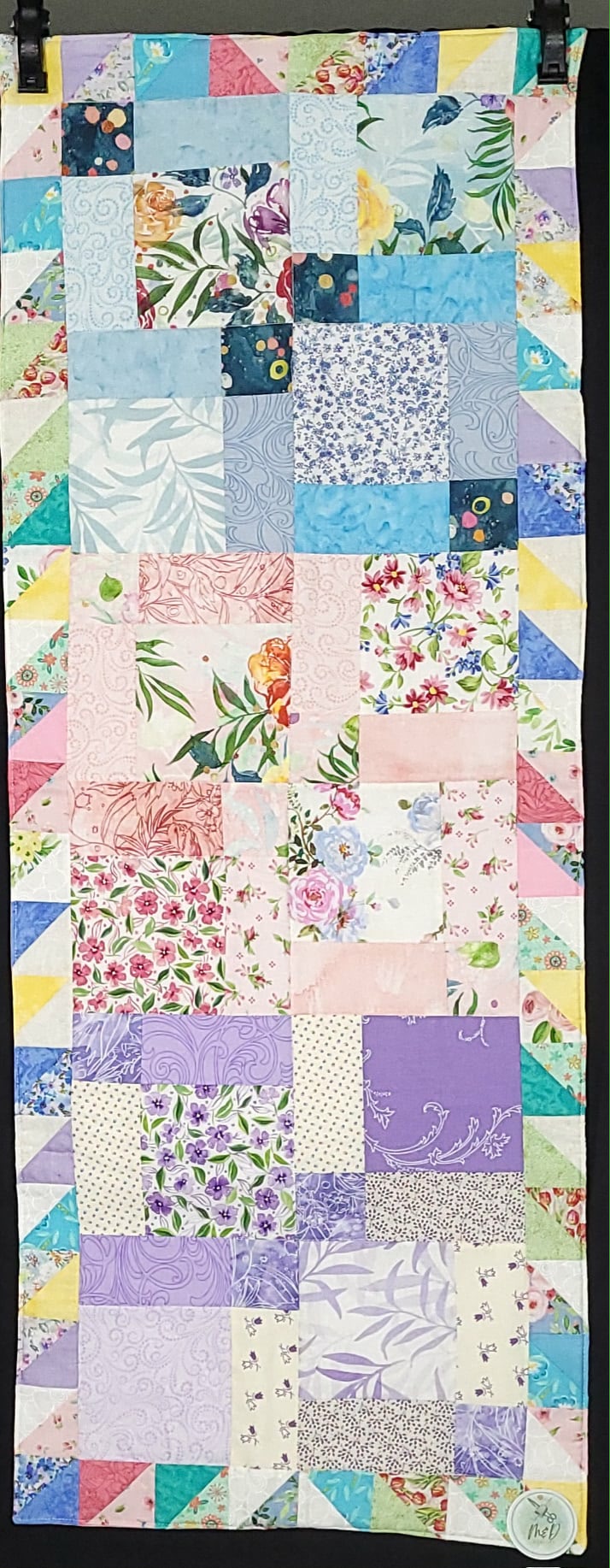 96b268_7af119d36f924c02ac93d5a2e65c8508mv2-1.jpeg Spring Half Square triangle table runner - Image 1